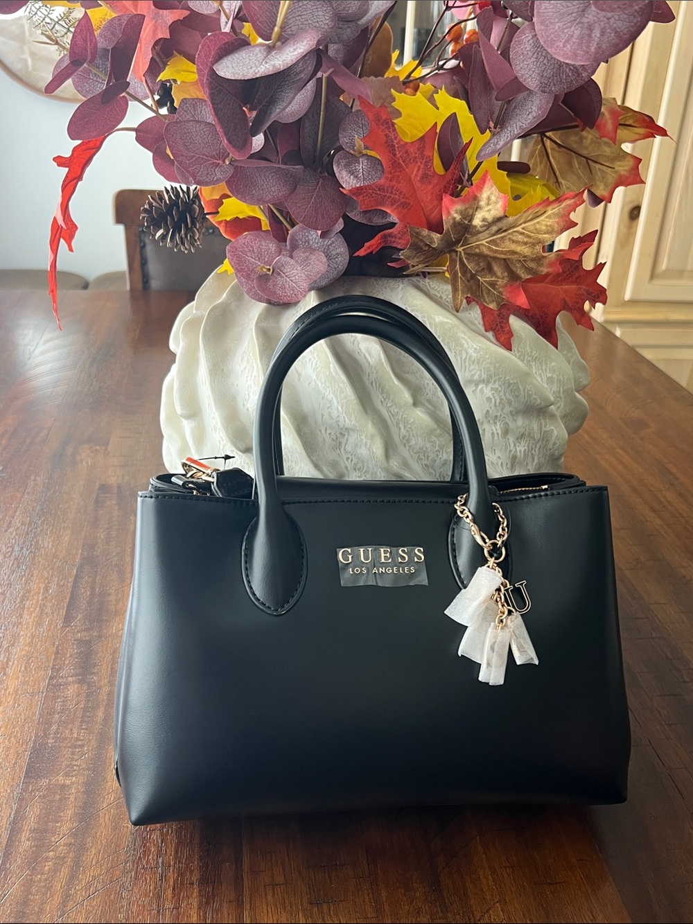 Guess Black Satchel with Gold Logo and Tassel Charm